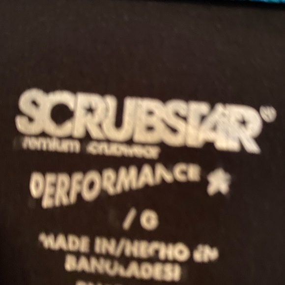 Black scrubs with teal accent. Small ankle split lots of pockets. - Picture 2 of 6